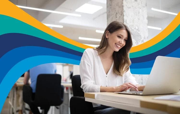 Smiling woman working on a laptop in an office, with a colorful wavy graphic overlaid.