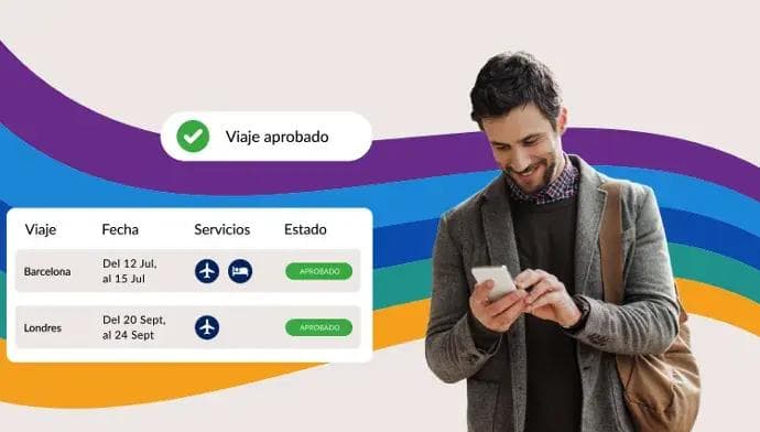 a man is looking at his phone in front of a rainbow background .
