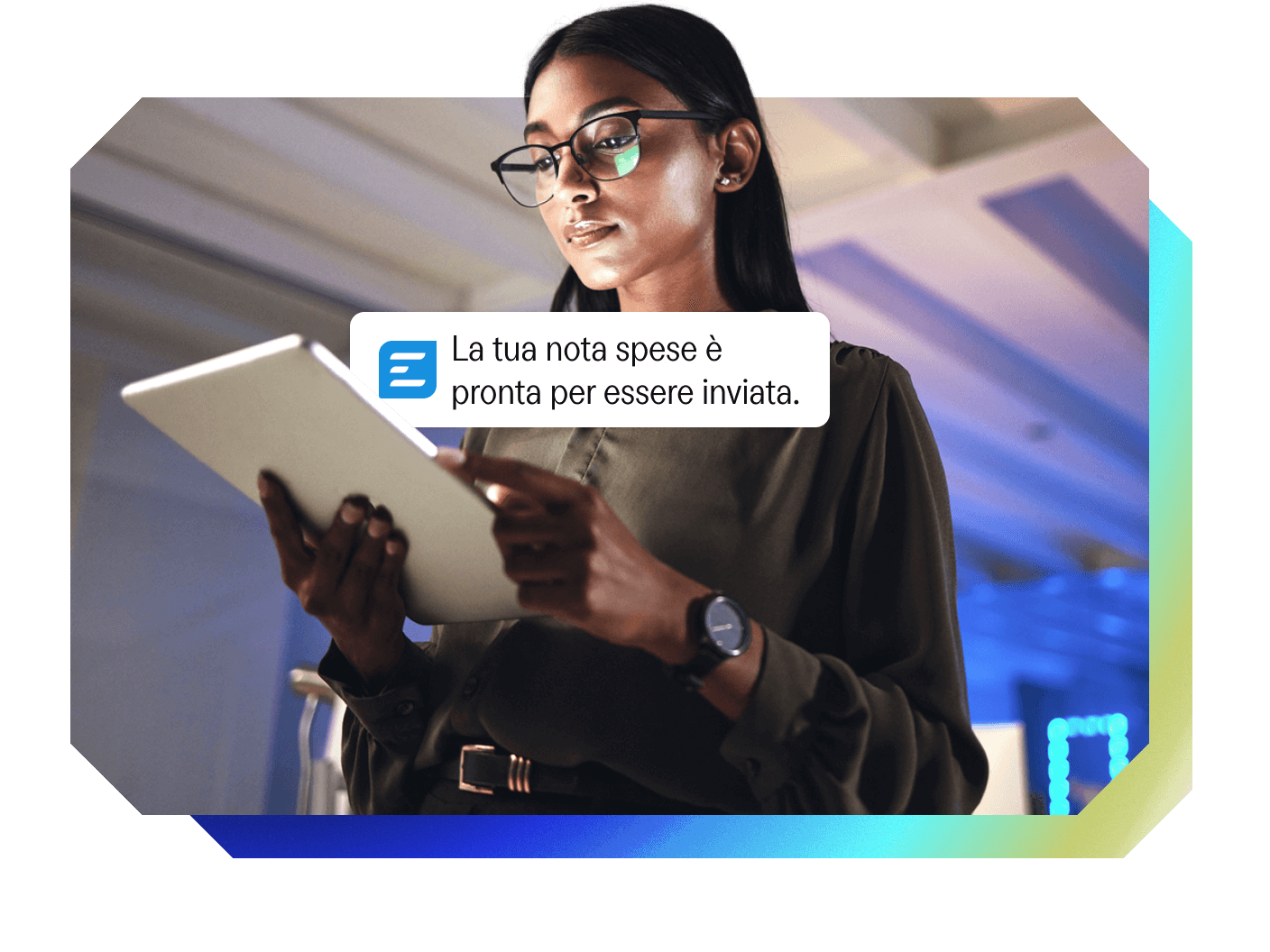 A woman holds a tablet displaying a notification that reads: "Your expense report is ready to be sent."