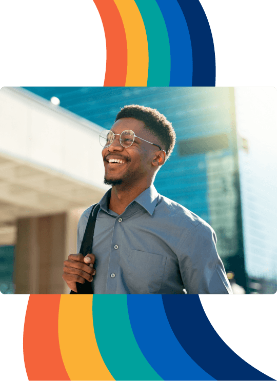 a man wearing glasses is smiling and carrying a briefcase