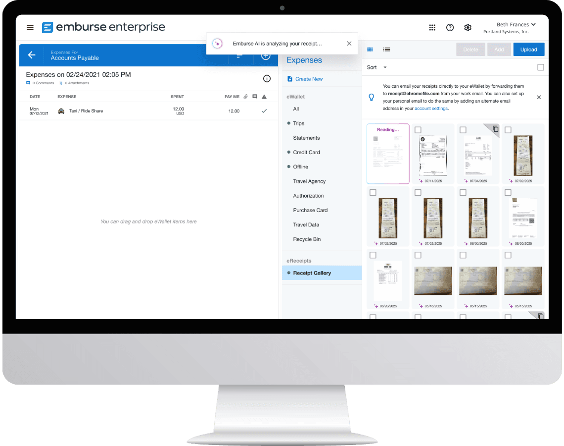 a computer screen shows a screenshot of the emburse enterprise app