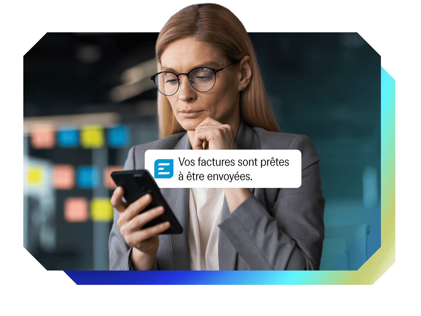 Woman looking at a phone displaying a notification: "Your invoices are ready to be sent."