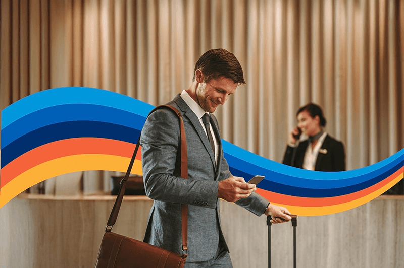 a man in a suit is looking at his phone