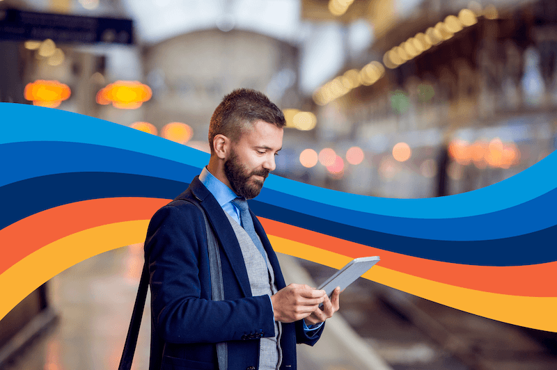 business traveler looking at tablet on the go