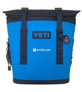 Blue and black Yeti soft cooler bag with Emburse logo.
