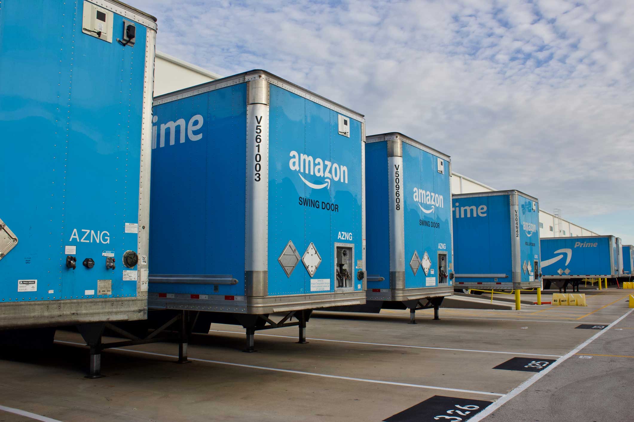 Amazon Prime trucks at a distribution center